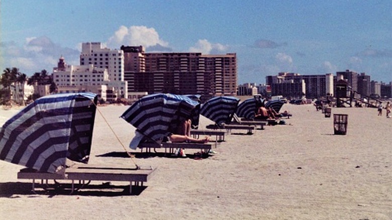 Canvas tents overlay beach loungers in Miami, 1982
