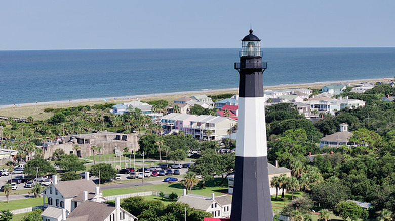 A tall black and white lighthouse on Tybee Island, Georgia