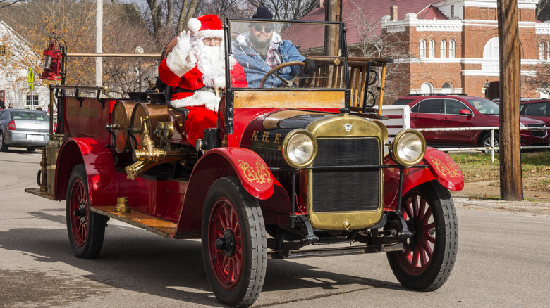 Christmas parade in Indiana with Christmas waving from a vintage car