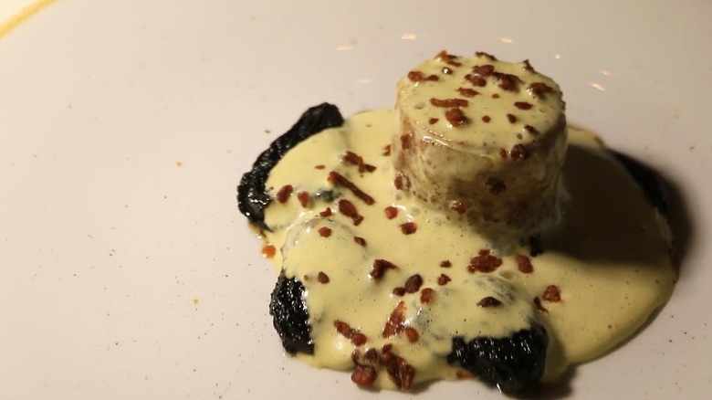 two unique dishes on a table at Le Clan