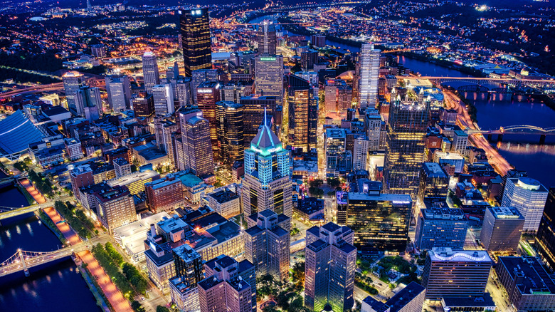 An aerial view of the downtown Pittsburgh cityscape at night