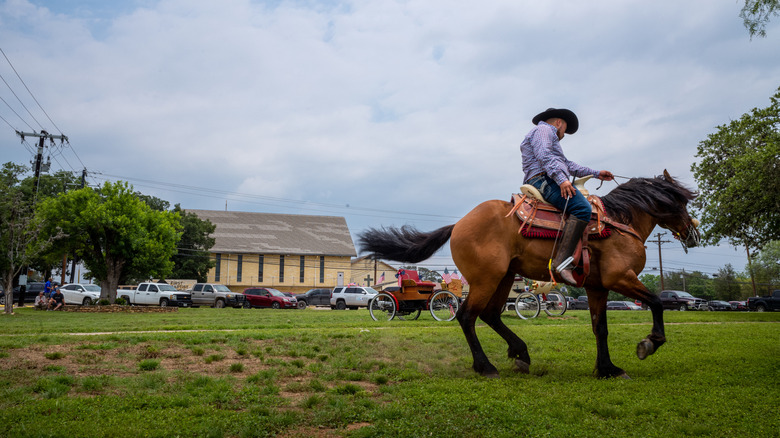A cowboy riding a horse in Bandera, Texas