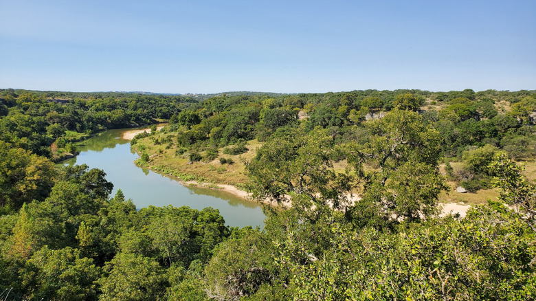 A river running through a natural area in Dripping Springs, Texas