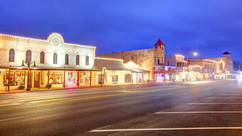 Main Street of Fredericksburg lit up at night