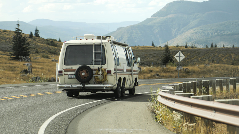 70s GMC Motorhome driving down the road