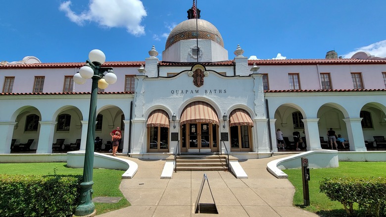 The front facade of Quapaw Baths on a sunny day