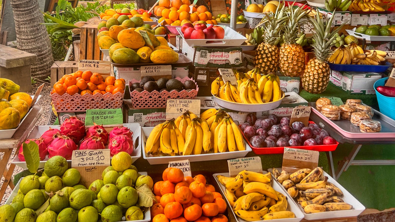A display of tropical fruits for sale at an Oahu farmers market