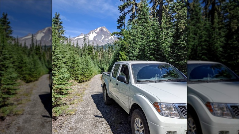 A pickup truck on the Old Barlow Road with Mt. Hood in the background