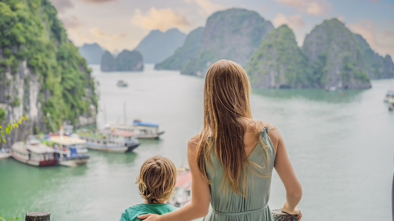 Mother and child looking out at Halong Bay
