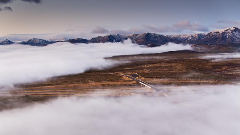 Aerial shot of a foggy landscape in West Texas, on the edge of the Davis Mountains and south of the city of Pecos.