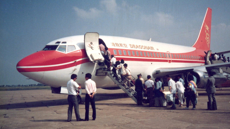 Passengers boarding a flight in the 1980s