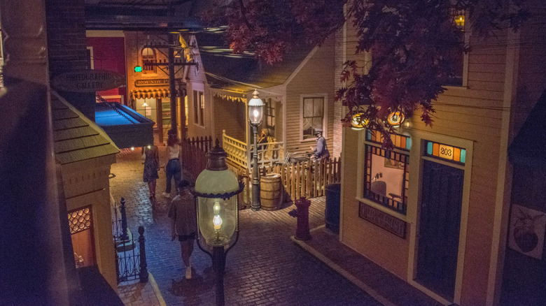 A recreated street scene of Old Milwaukee with houses and people at Milwaukee Public Museum
