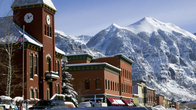 Mountains rise behind the historic buildings of old Telluride