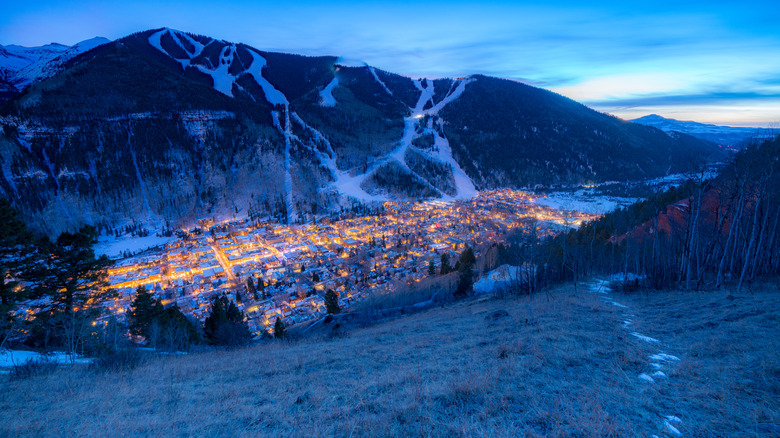 The town of Telluride in a valley at dusk