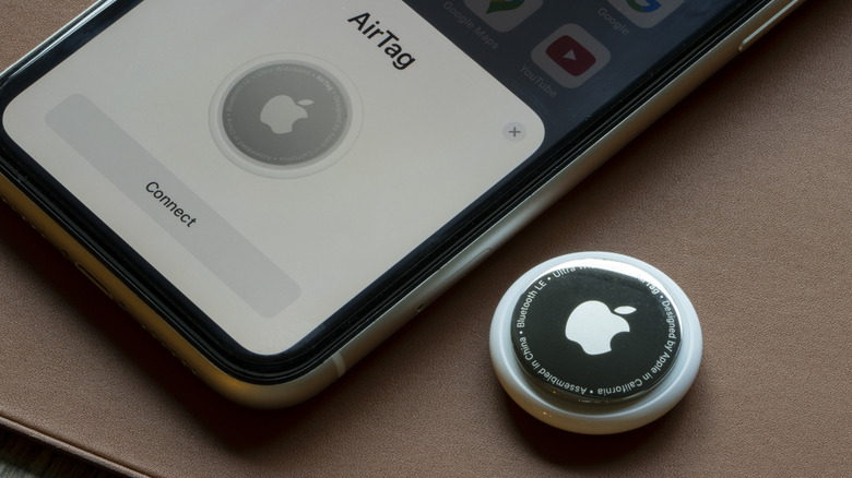 An Apple AirTag connecting to an iPhone