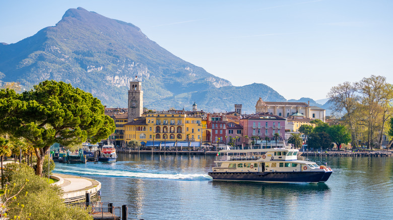 A village with a mountain backdrop in the Trentino region of Italy