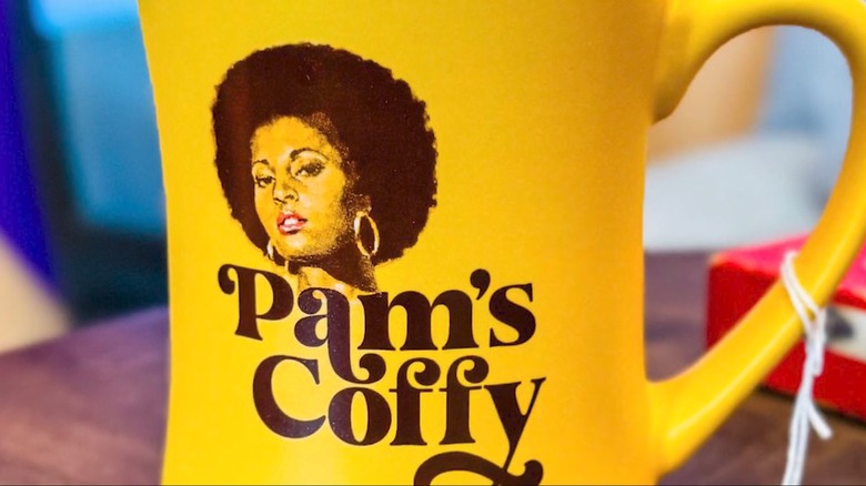 A closeup image of a Pam's Coffy mug
