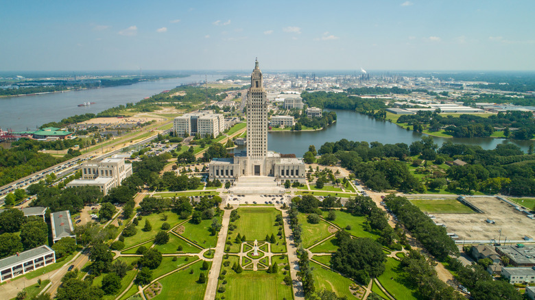 Baton Rouge's capitol building silhouette and green park against skuline
