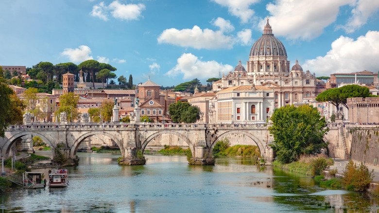 St.Peter's Basilica and Vatican overlook Tiber River in Rome