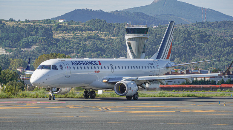 Air France plane on runway with mountainous backdrop