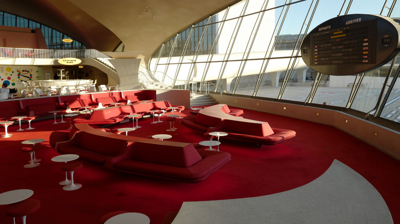 View of TWA lounge area with red mid-century furnishings at JFK International Airport in New York City