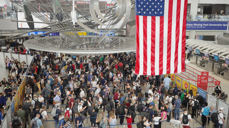 Overhead view of a massive group at travelers at a security checkpoint at JFK International Airport on July 3, 2025