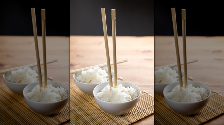 Chopsticks stuck upright in a bowl of rice resemble Vietnamese funeral rites involving incense sticks