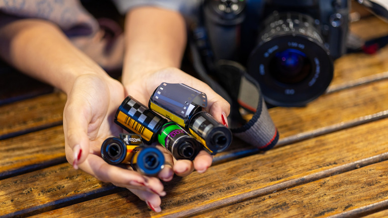 Person holding film for a camera