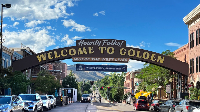 A view of the Welcome to Golden Sign that sits at the start of Washington Avenue in Golden, Colorado