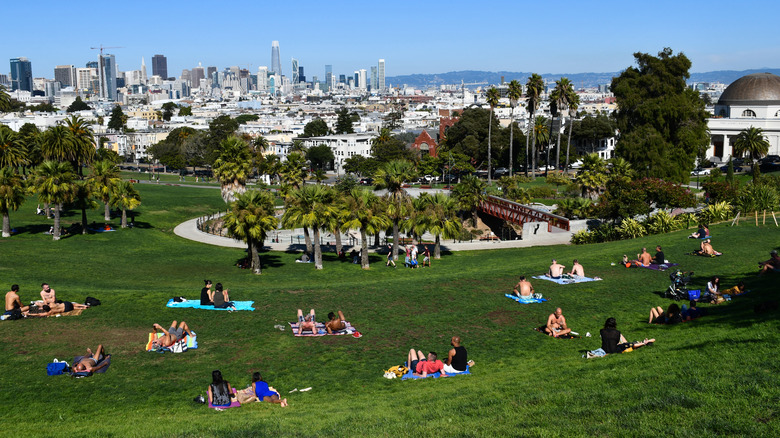 People relaxing at Mission Dolores Park