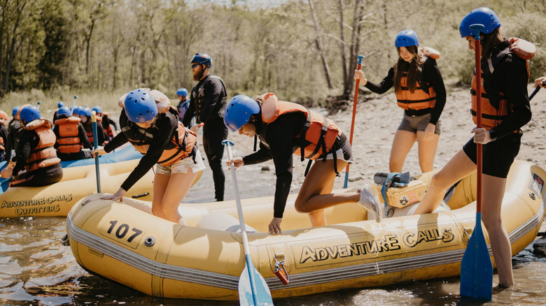 People boarding raft to go whitewater rafting on the Genesee River in Letchworth State Park