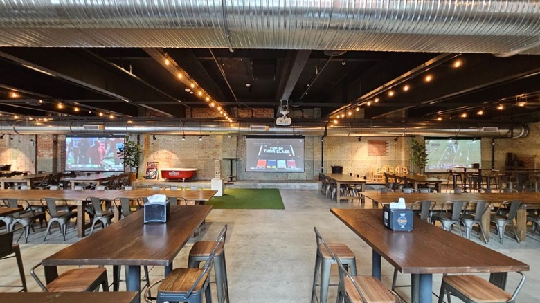 The interior of the Wonder Building in Spokane with family style long wooden tables