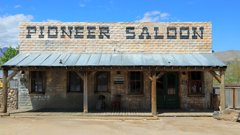 Frontal image of the historic, white-brick Pioneer Saloon in the ghost town of Goodsprings, Nevada