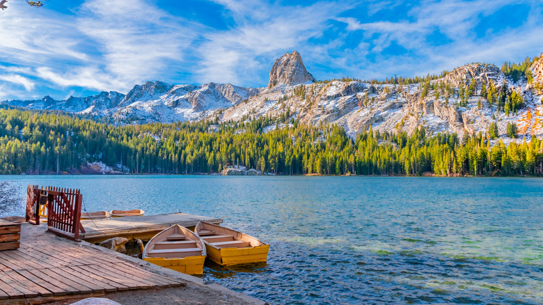 Two row boats at a wooden dock on Lake George in the Mammoth Lakes region of California