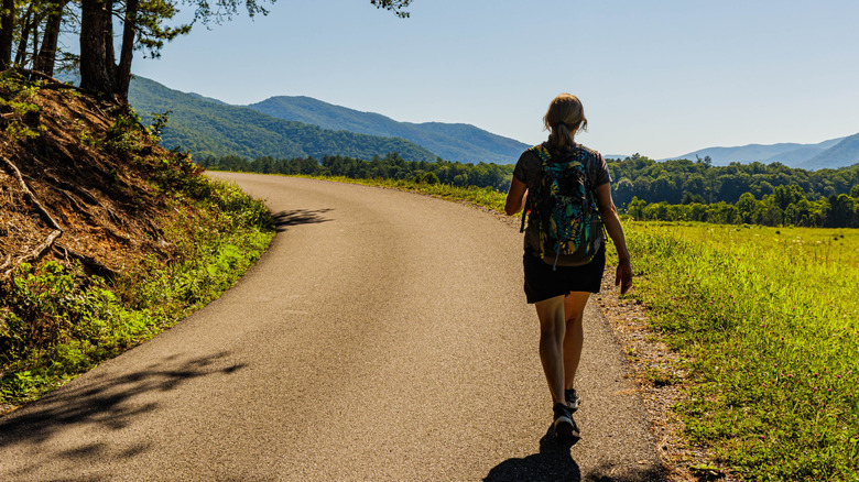 A female hiker in the Cades Cove area of Great Smoky Mountains National Park