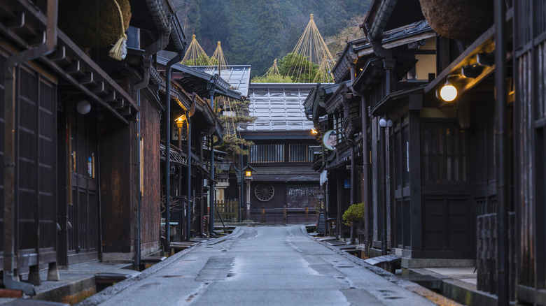empty village street with traditional wooden architecture
