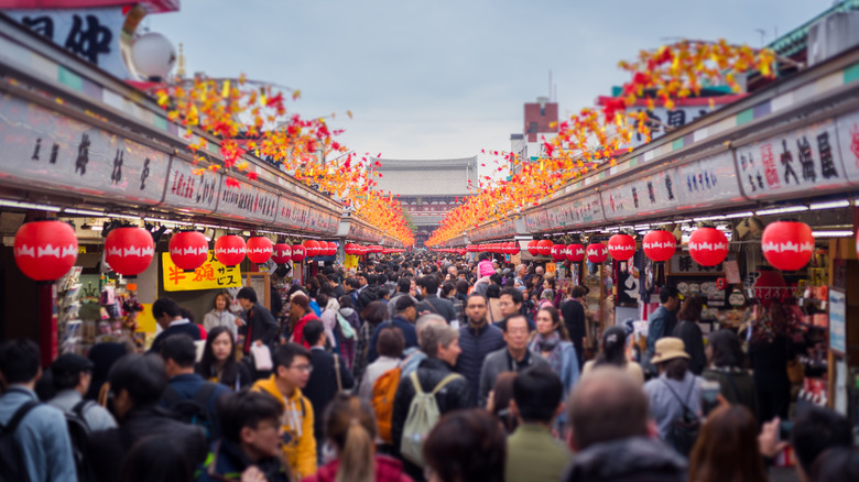 crowds of people at an outdoor market