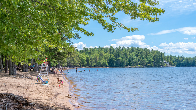 A sandy beach with a lifeguard station on Maine's Sebago Lake