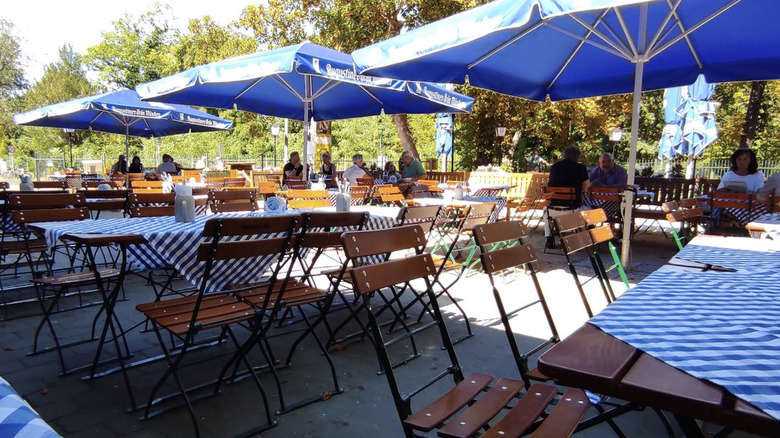 Tables with blue umbrellas at Bürgerbahnhof Potsdam