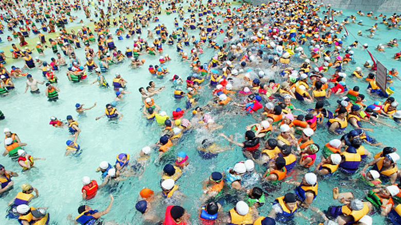 A crowded pool in a water park