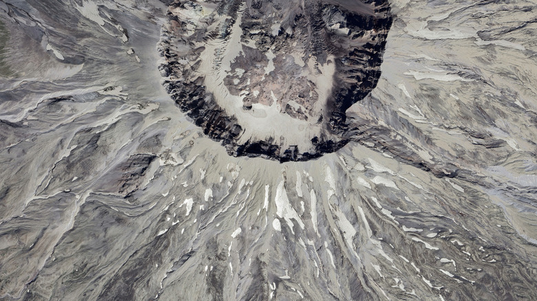 An aerial view of the crater and blast zone at Mount St. Helens.