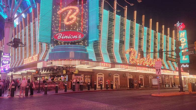 Binion's Hotel and Casino building exterior, sign, and neon lights at night on Fremont Street