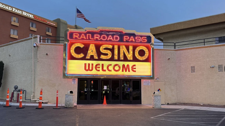 View of Railroad Pass Casino welcome sign with the Railroad Pass Hotel in background