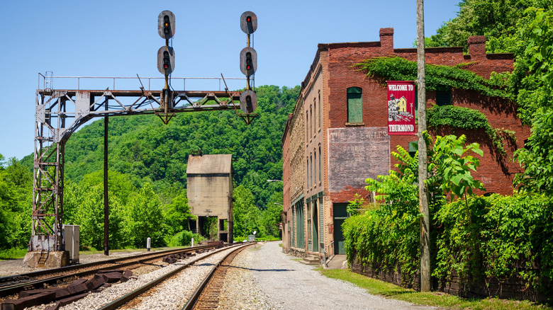 The railroad passes under the brick buildings of abandoned Thurmond, West Virginia