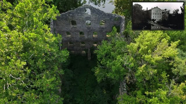 Roofless stone ruins from above, surrounded by trees, with a black-and-white image of what it used to look like inset in the upper right corner