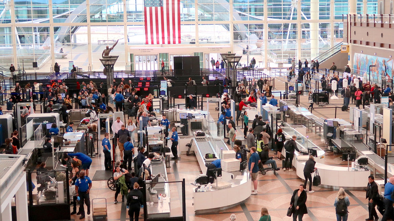 People waiting to go through security at Denver International Airport