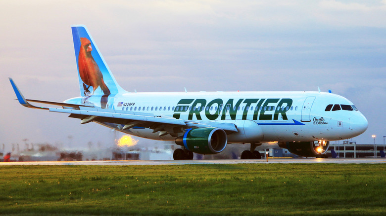 Frontier Airlines A320 (featuring Orville, the red cardinal) just landed at Cleveland Hopkins International Airport at dawn