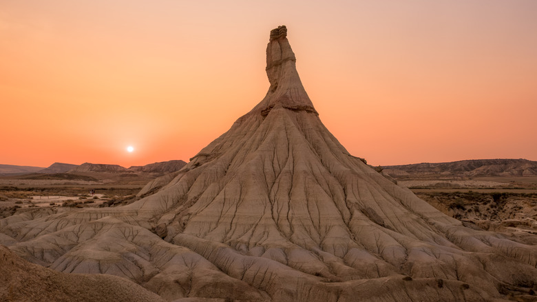 Castildetierra hoodoo rock formation at dramatic sunset in Bardenas Reales