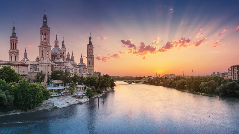 Sun setting over the river by the cathedral in Zaragoza