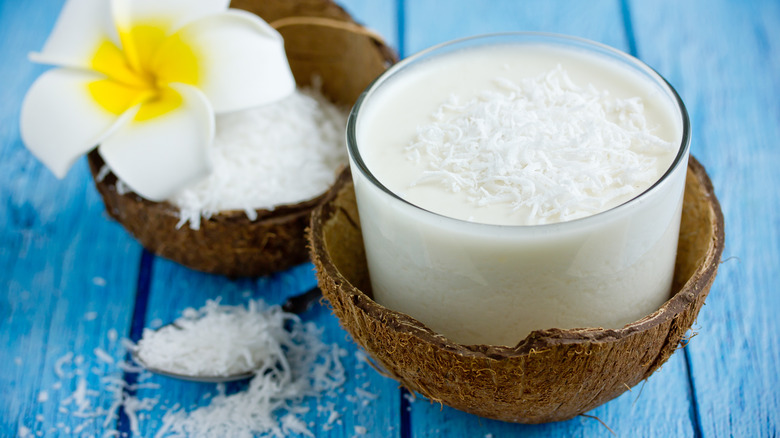 creamy white cocktail in coconut
